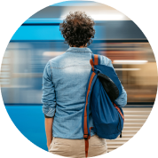 image of a man in front of a train speeding by