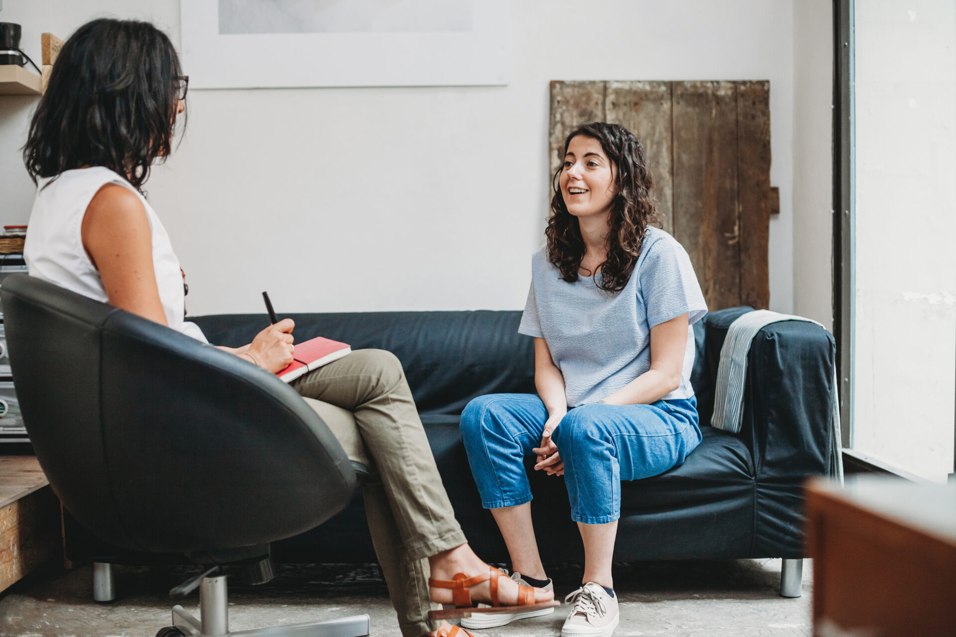 a woman talking to a therapist