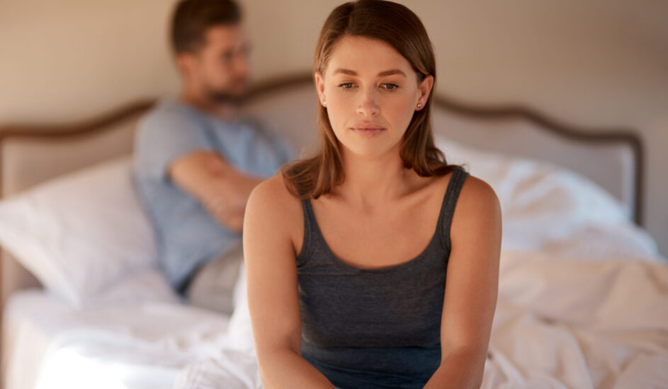 an unhappy couple navigating relationship anxiety