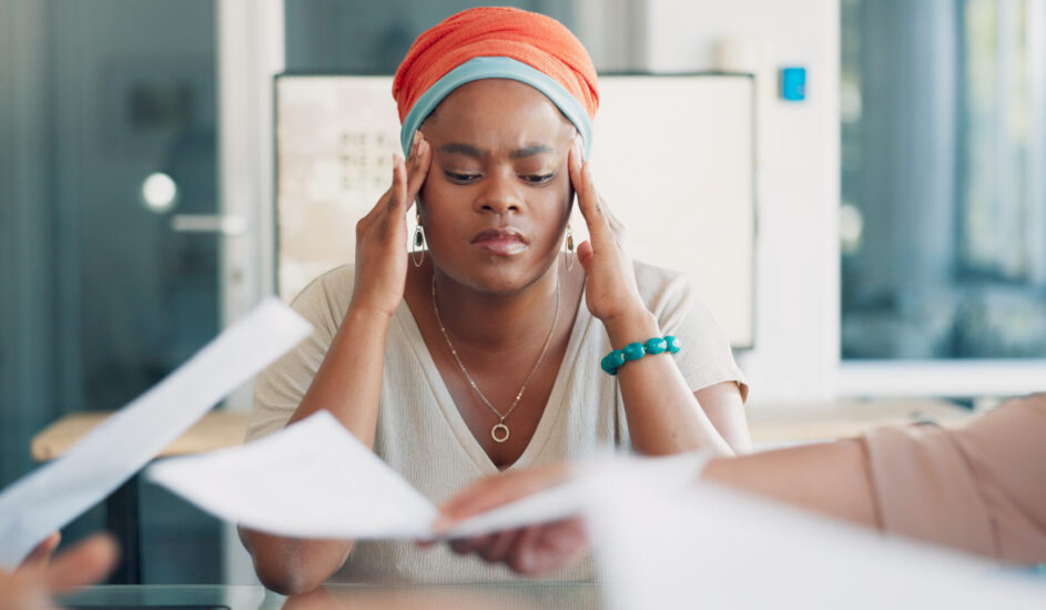 a woman struggling with cognitive distortions at work