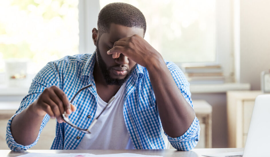 a man experiencing stress at his desk