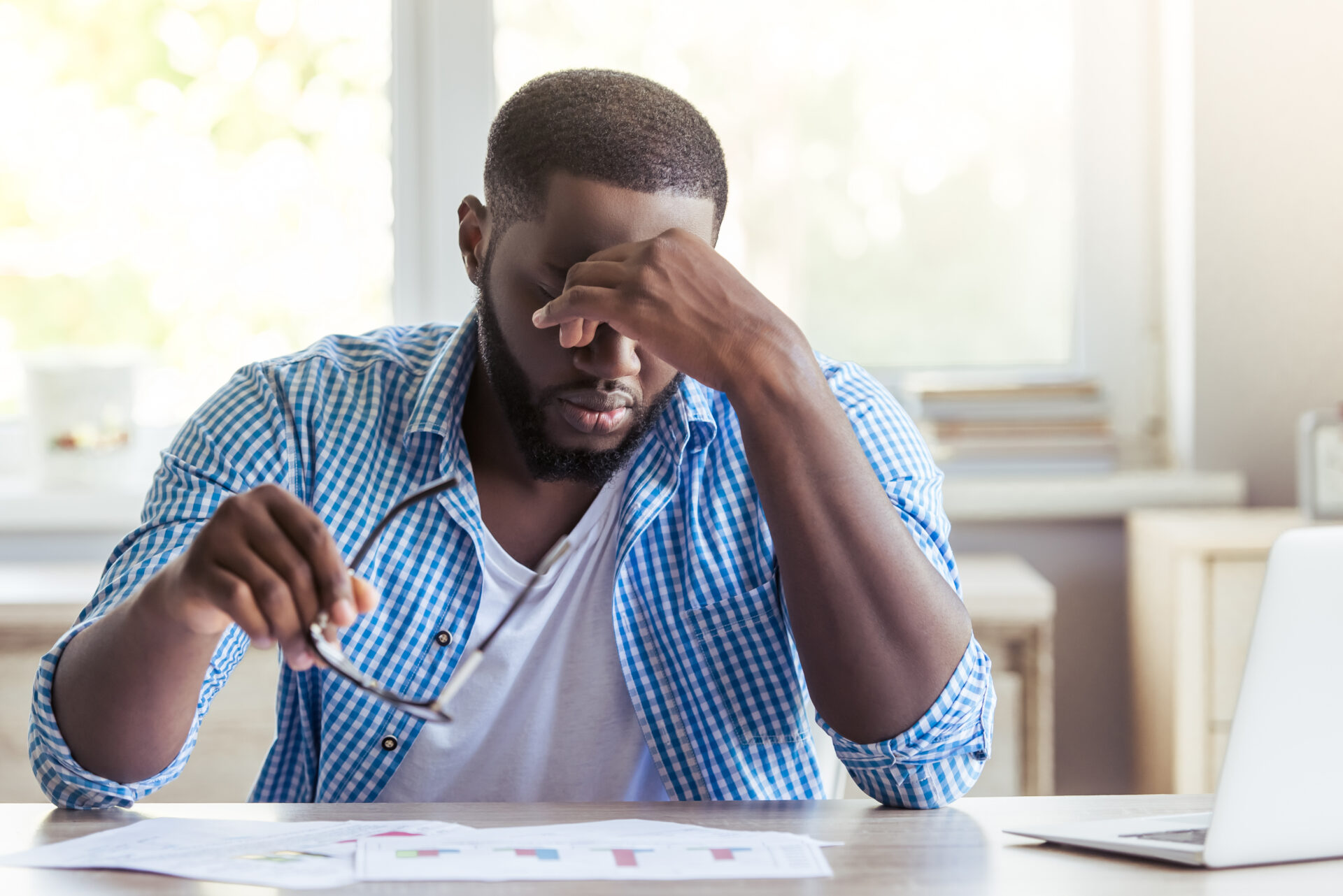 a man experiencing stress at his desk