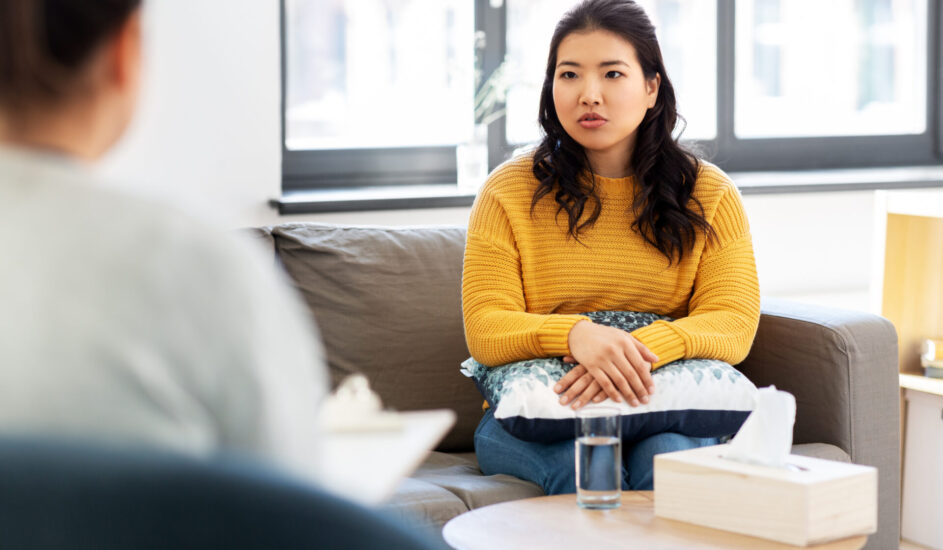a woman talking to a therapist, depicting Dialectical Behavioral Therapy
