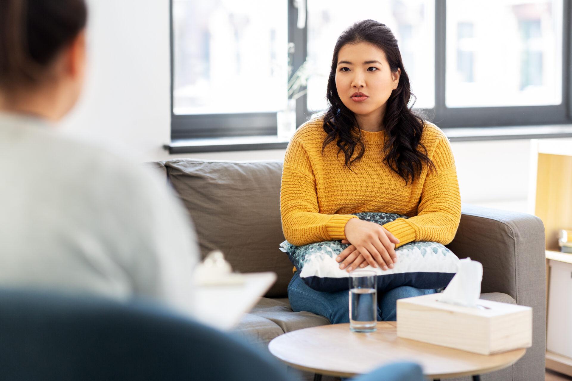 a woman talking to a therapist, depicting Dialectical Behavioral Therapy